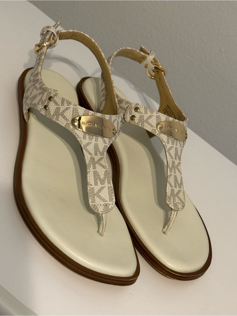 Michael Kors Cream/White Logo T-Strap Sandals with Gold Plaque